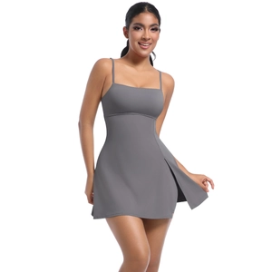 Detail view of dark grey athletic dress featuring thin straps and side slit design