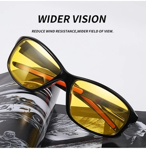 Detail of yellow polarized lenses on black and red cycling sunglasses with wide vision