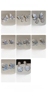 Detailed specs for butterfly pearl earrings showing dimensions, weights and materials