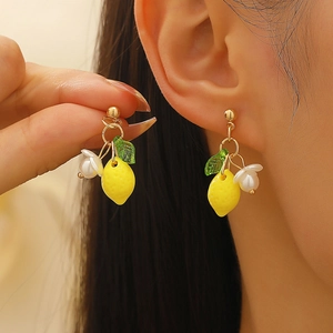 Handcrafted yellow lemon drop earrings with green leaves and white floral pearl accents