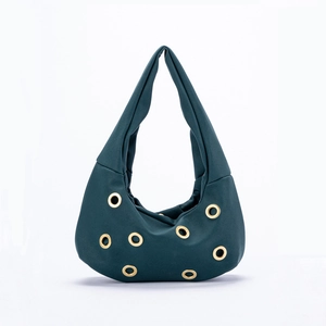Deep green hobo bag with gold metal eyelets and a minimalist hobo design on white backdrop