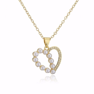 Close-up of 18K gold plated hollow heart necklace with premium pearl and zircon accents
