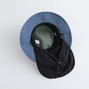Detail of UV protection hiking hat featuring neck flap, adjustable cord, and L size label
