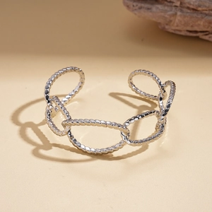 Detailed view of silver-tone oval open cuff bracelet with twisted rope texture design