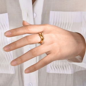 Elegant gold-plated chevron double-wave ring with pavé cubic zirconia on model