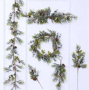 A complete set of artificial Christmas wreaths and garlands with pine cones and white berries