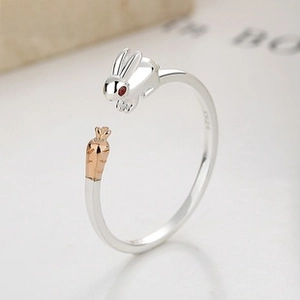 Macro shot of S925 sterling silver stamp and cute carrot rabbit detail on open ring