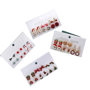 Festive Christmas stud earring set with reindeer and snowflake motifs on display cards