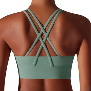 Reggiseno sportivo verde salvia con incrocio sulla schiena, orlo largo e tessuto elastico