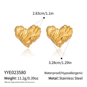 Detailed view of gold heart stud earrings with dimensions and stainless steel material info