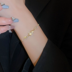 Elegant gold hulu bracelet featuring cat eye stone and zircon accents for women