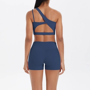Detailed back view of a navy blue one-shoulder sports bra and high-waisted shorts set