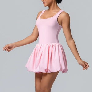 Close-up of pink tennis dress featuring a puffy bubble skirt and backless design