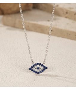 Close-up of S925 silver necklace featuring a blue and white zircon evil eye pendant