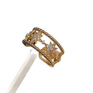 Golden double-layer open star ring with cubic zirconia stones and beaded edges