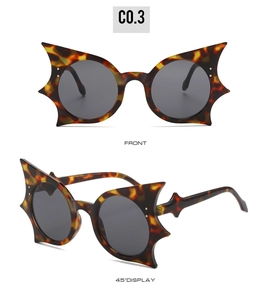 Front and side view of bat shaped tortoise shell hip hop sunglasses with gray lenses