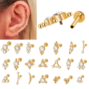 Detailed cluster of gold-plated 316L stainless steel studs with CZ triangular crystals