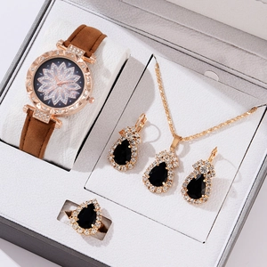 Elegant rose gold quartz watch set with black teardrop gemstone jewelry in gift box