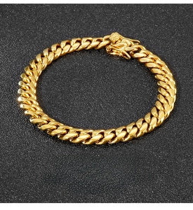 Close-up of polished 8mm gold stainless steel Cuban link chain with lobster clasp