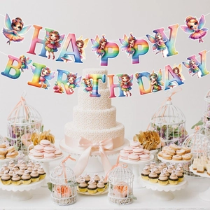 Rainbow happy birthday banner with fairy elf figures hanging over a dessert party table