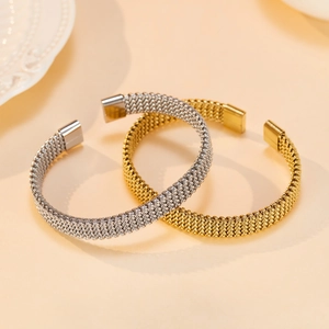 Minimalist woven stainless steel cuff bracelet in gold and silver finish for women