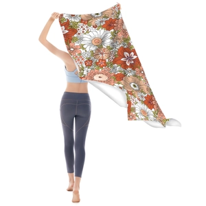 Quick-dry microfiber beach towel with vintage floral pattern worn by a female model