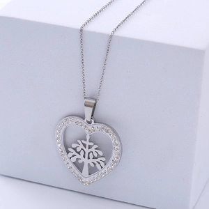 Silver heart pendant necklace with tree of life design and sparkling white crystals