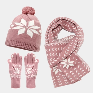 Pink winter knit set with snowflake patterns including hat, scarf, and warm gloves