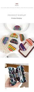 Close-up of bohemian polka dot acrylic hair claws with geometric patterns and metal springs