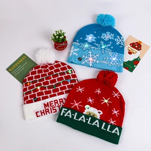 Close-up of LED Christmas hats with colorful patterns and glowing light bulbs