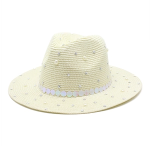 Detail of cream straw fedora hat with pearls, rhinestones and iridescent sequin band