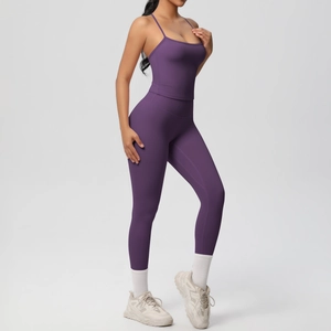 Close-up of deep purple yoga set showing high-waist leggings and thin strap sports bra