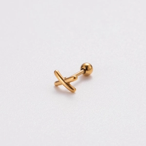 Macro shot of gold X-shaped stainless steel stud earring with screw-back closure