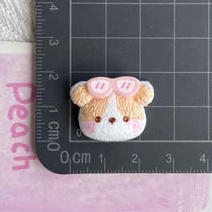 Detailed scale view of a 2.5cm cartoon resin dog charm with pink glasses for DIY crafts