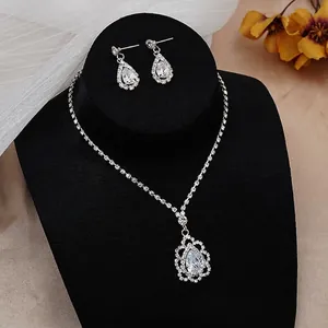 Macro shot of silver bridal necklace set with teardrop zircons on a black stand