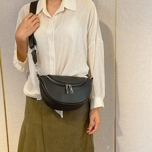 Classic black leather crescent crossbody bag with lychee texture and wide strap