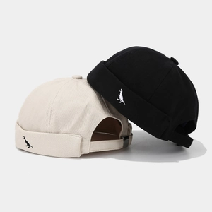 Black and beige street style brimless docker hats featuring dinosaur embroidery