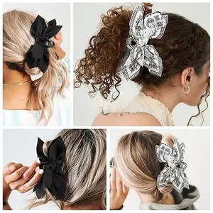 Detail of large paisley and black bow hair clips on blonde and brunette hair styles