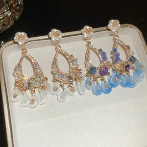 Elegant palace style flower tassel earrings with pearls and crystals in a jewelry box