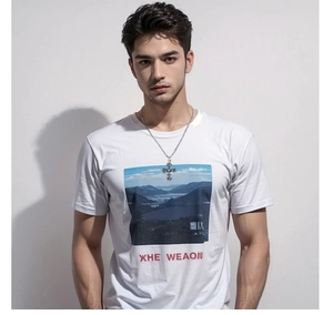 Detail of silver stainless steel cross bat necklace worn by a male model on white tee