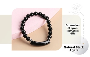 Detail of natural black agate beaded bracelet with curved tube and silver spacers
