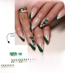 Detail of green French tip press on nails with St. Patrick's clover patterns
