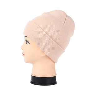 Detail view of the soft pink ribbed knit beanie showing thick cuff and warm texture