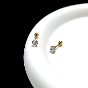 Detail of 0.8mm titanium steel stud earrings with gold plating and zircon crystals