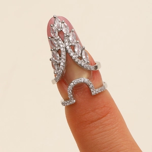 Macro shot of silver zircon nail ring with marquise cut stones in a two-section leaf design