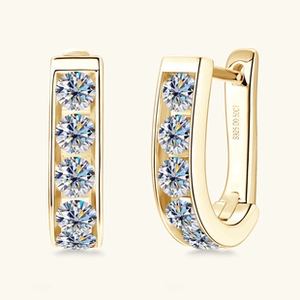 Close-up of S925 sterling silver stamp and 0.50ct moissanite detail on U-shaped gold earrings