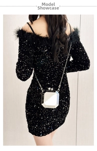 Mirror acrylic box bag with metal chain shown on a black sequin feather evening dress