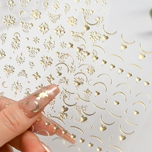 Champagne gold star and moon nail stickers with heart patterns shown applied on nails