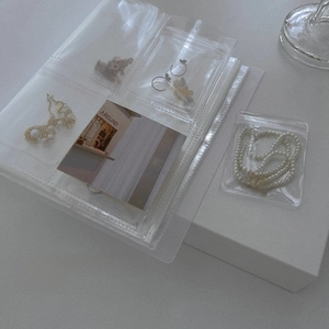 Detailed view of clear PVC jewelry storage book with anti-oxidation sealing bags
