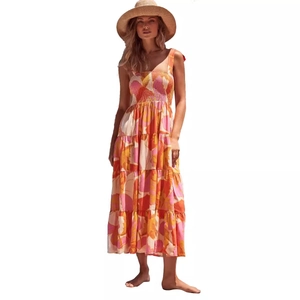 Bohemian floral maxi dress with tiered skirt and adjustable straps in orange and pink